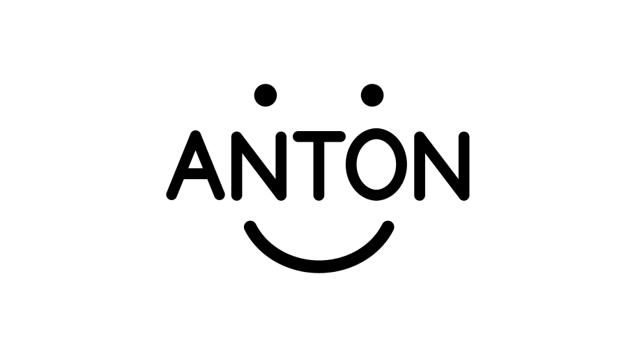 The word ANTON is styled with two dots above it and a curved line below, forming a smiley face design.